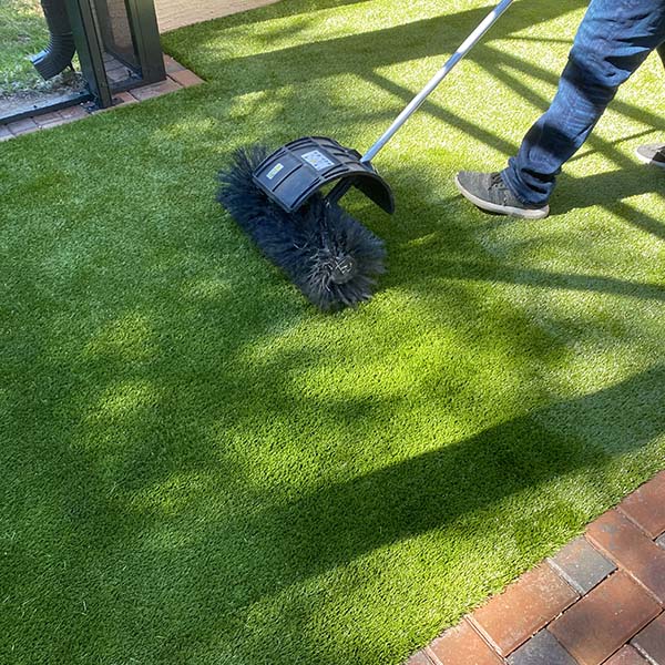guy installing Artificial Turf